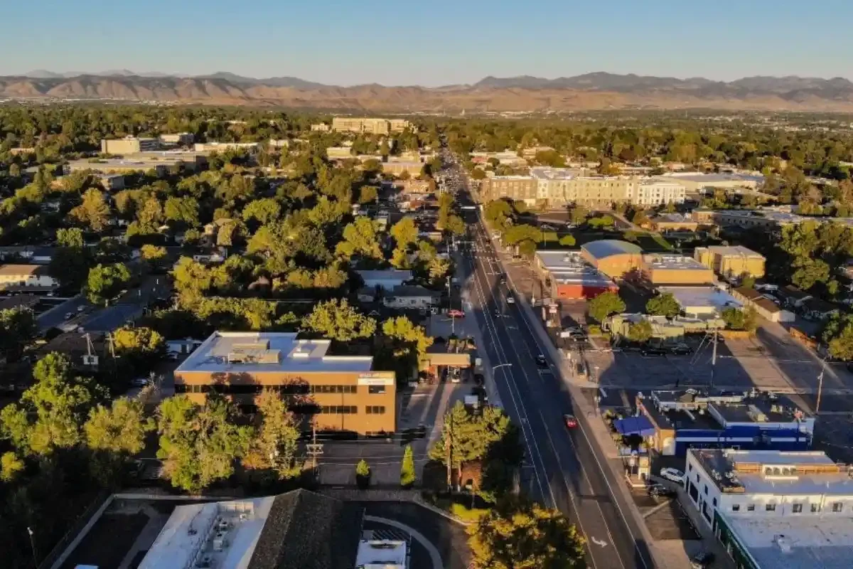 Aerial view of Wheat Ridge, CO with the Rocky Mountain foothills in the distance